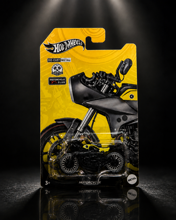 Die-cast bagger motorcycle collectible on dark studio background