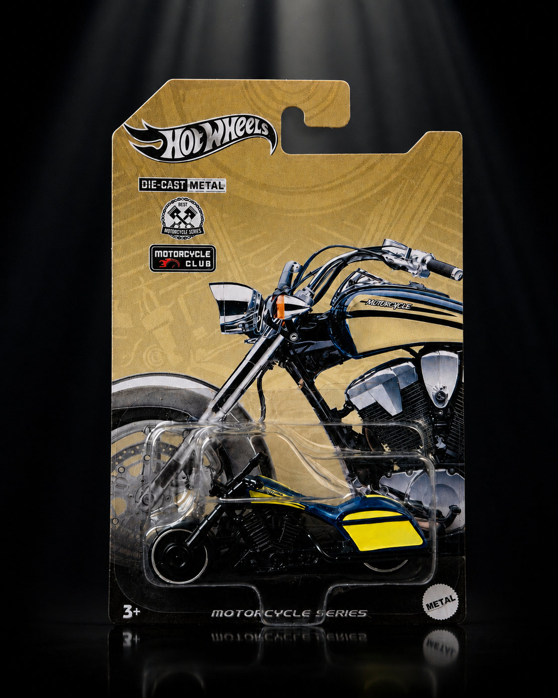 Die-cast chopper motorcycle on dark studio background