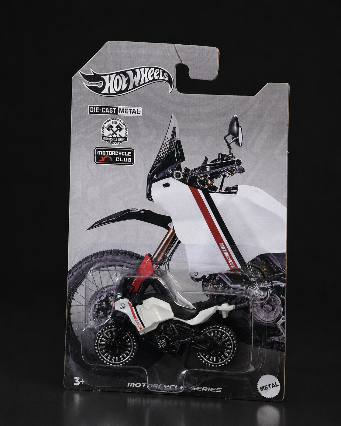 Die-cast rally motorcycle, angled studio view