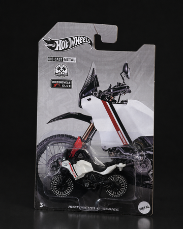 Die-cast rally motorcycle, angled studio view