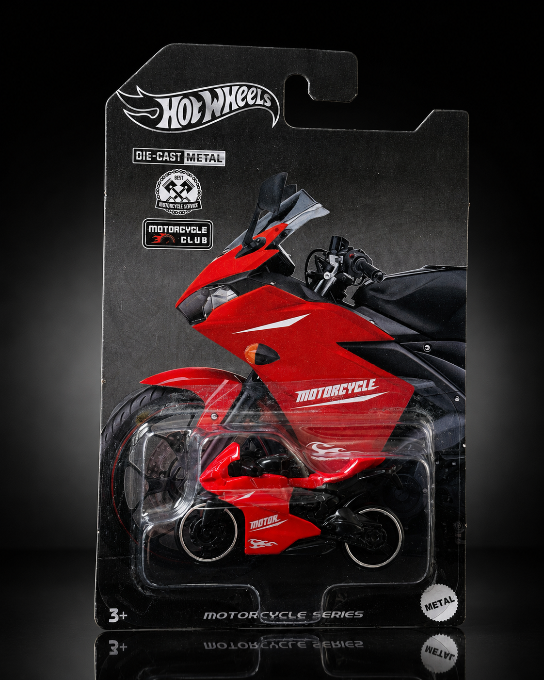 Die-cast sport motorcycle on dark studio background