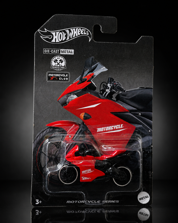 Die-cast sport motorcycle on dark studio background