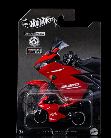 Die-cast sport motorcycle in racing red — collector card front view