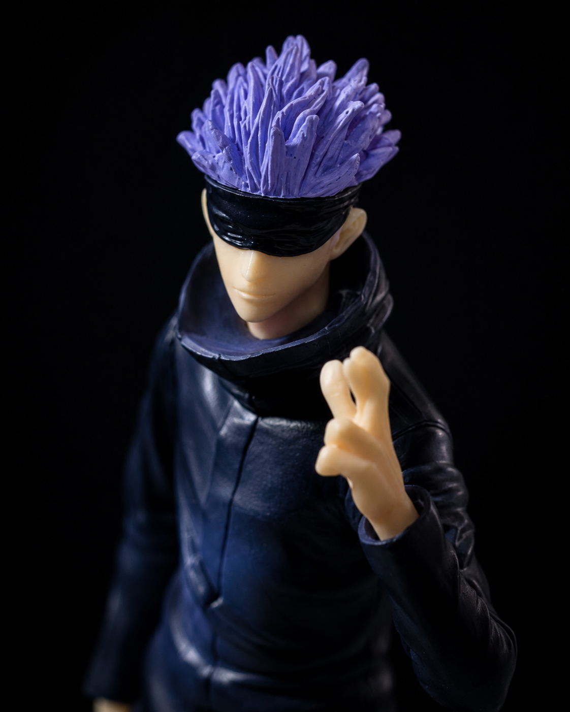 Gojo Satoru standing anime figure on dark studio background