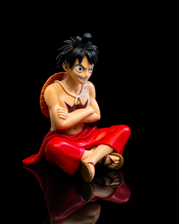 Luffy sitting anime figure, side view